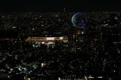 Drones fly over the National Stadium during the opening ceremony of the Tokyo 2020 Olympics. AP Photo