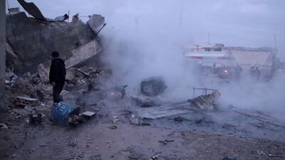 Members of the Syrian Civil Defence, known as the White Helmets, fight a fire following a reported airstrike on the village of Kafr Nuran, in the western countryside of Aleppo province on Tuesday. AFP