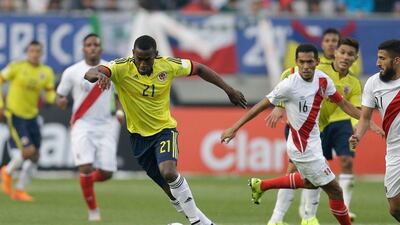 Jackson Martinez, left, in action for Colombia at Copa America, has agreed a move to Atletico Madrid. Natacha Pisarenko / AP Photo
