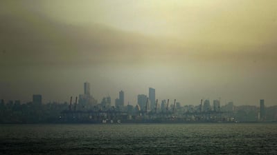 A picture taken from Dbayeh, north of Beirut, shows the skyline of the Lebanese capital covered in smog at sunset. AFP