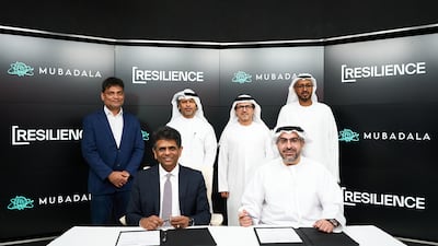 Badr Al Olama executive director, UAE Clusters at Mubadala (R) and Rahul Singhvi, chief executive of Resilience, at the signing ceremony. Photo: Mubadala