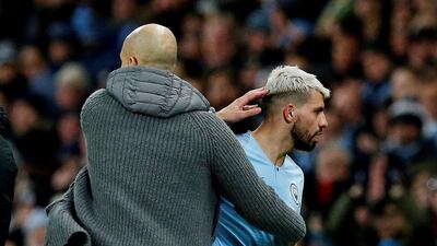 Manchester City's Sergio Aguero with manager Pep Guardiola as he was substituted. Reuters