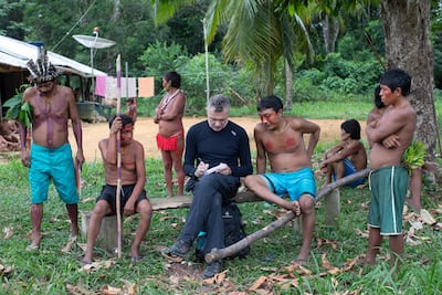Dom Phillips with members of an indigenous community in the Brazilian Amazon. AFP