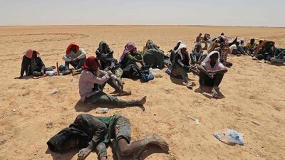 Migrants from sub-Saharan Africa who claim Tunisian authorities abandoned them in the desert without water or shelter, near Libyan border town Al-Assah. AFP
