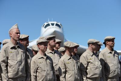 Russian Air Force personnel stand in front of a Tupolev Tu-160 strategic long-range heavy supersonic bomber aircraft upon landing at Maiquetia International Airport. AFP
