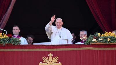 Pope Francis at the balcony to deliver his Christmas Urbi et Orbi blessing in St Peter's Square at the Vatican. AFP