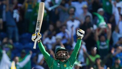 Pakistan's Mohammad Hafeez celebrates after Pakistan won the ICC Champions Trophy semi-final cricket match against England in Cardiff on June 14, 2017. Set just 212 for victory, Pakistan finished on 215 for two, with Azhar Ali (76) and Fakhar Zaman (57) sharing an opening partnership of 118. Geoff Caddick / AFP