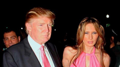 Donald Trump and Melania Trump, in a hot-pink halter dress, arrive at the birthday party of Shaquille O'Neal at Hotel Victoria in Miami Beach, US, on March 5, 2005. EPA