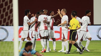 Al Waha players celebrate after scoring the second of their six goals in an Etisalat Cup rout of Al Shaab. Ravindranath K / The National