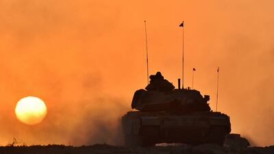 A Turkish army tank moves, in Silopi, near the Habur border gate with Iraq, south-east Turkey. AP