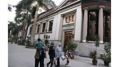 An Egyptian family walks past the closed Egyptian stock exchange in Cairo. The political situation in some Mena region countries may support a further rise in the price of oil.