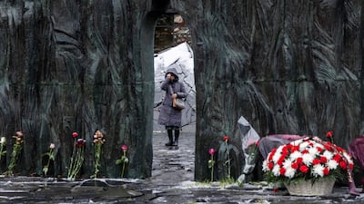 A woman at the Wall of Grief monument on a remembrance day for the victims of political repressions in Moscow. Reuters