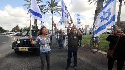 Protesters try to block an entrance to Ben Gurion Airport during a demonstration against the government's judicial reform bill. AFP