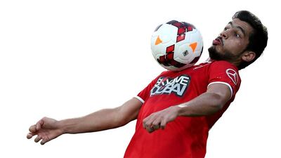 Al Ahli's Majed Hassan gets control of the ball during a game against Al Dhafra in Dubai. (Sammy Dallal / The National)