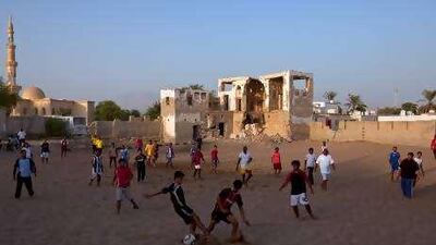 The sand-covered courtyard provides the ideal pitch, which is marked out by worn tyres.