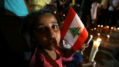 Palestinians light candles in Rafah in the southern Gaza Strip. REUTERS