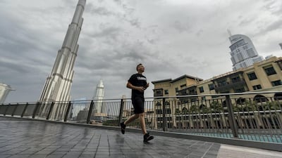 Dark clouds and rain surround the Burj Khalifa, Downtown, Dubai. Chris Whiteoak / The National