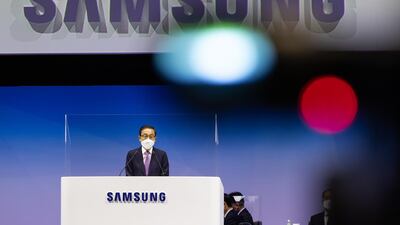 Kim Ki-nam, co-vice chairman and co-chief executive officer of Samsung Electronics Co., speaks from behind a transparent screen during the company's annual general meeting at the Suwon Convention Center in Suwon, South Korea. Bloomberg