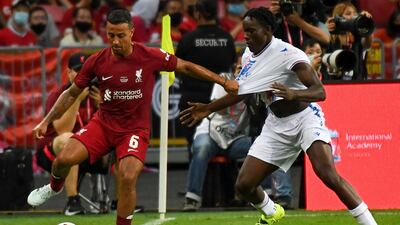 Liverpool's midfielder Thiago Alcantara holds off Crystal Palace's David Ozoh. AFP