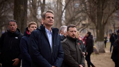 Ukraine's President Volodymyr Zelenskyy and Greek Prime Minister Kyriakos Mitsotakis visit a makeshift memorial to the victims of previous day's drone strike that heavily damaged an apartment building, amid Russia's attack on Ukraine, in Odesa. Reuters