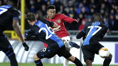 Mats Rits, left, and Clinton Mata of Brugge in action against Jesse Lingard of Manchester United. EPA