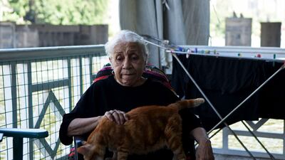 Ikhlas Helmy, an 88-year-old owner of a houseboat in Cairo, Egypt, sits on the veranda on June 27, 2022. A government push to remove the string of houseboats from Cairo’s Nile banks has dwindled their numbers from a several dozen to just a handful. Helmy stands to evicted, and the boat moved or demolished. The tradition of living on the Nile River dates back to the 1800s, and the removal of the boats has drawn criticism in Egypt. The government says it plans to develop the waterfront. (AP Photo / Tarek Wagih)