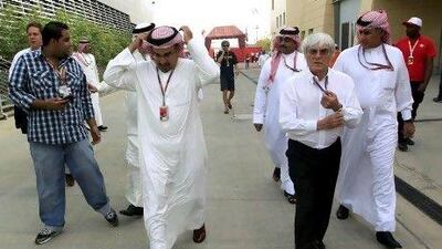 Sheikh Salman bin Hamad Al Khalifa, left, and Bernie Ecclestone in the paddock at the Bahrain International Circuit.