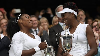 Serena Williams and Venus Williams celebrate winning their women's doubles final against Timea Babos and Yaroslava Shvedova at Wimbledon on Saturday. Tony O'Brien / Reuters / July 9, 2016