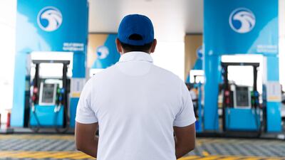 Adnoc's first service station opens in Dubai. The company has receive AA+ rating from Fitch. Reem Mohammed / The National