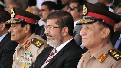 Former chief of staff of the Egyptian armed forces, Sami Anan, right, will stand against president Abdel Fattah El Sisi