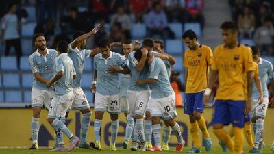 Celta Vigo's forward Nolito, centre, celebrates with teammates after scoring against Barcelona. Miguel Riopa / AFP