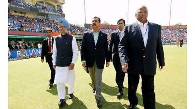 The prime ministers of India and Pakistan, Manmohan Singh, left, and Yousuf Raza Gilani, centre, walk the cricket pitch ahead of a match that many readers said had much more importance than mere sport. Daniel Berehulak / EPA