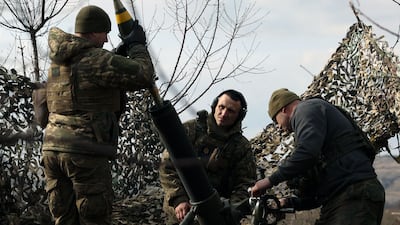 Ukrainian soldiers load a 120mm mortar to fire towards Russian positions in the Donetsk region on Saturday. AFP