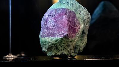 The gem has a variegated purplish-red hue and was mined in Winza, Tanzania.