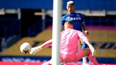 Everton's Richarlison, background, assists teammate Dominic Calvert-Lewin to score their side's fourth goal past West Bromwich Albion's goalkeeper Sam Johnstone. AP