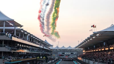 Etihad Airways fly past and aerobatic display by Al Fursan during the UAE national anthem. Victor Besa / The National