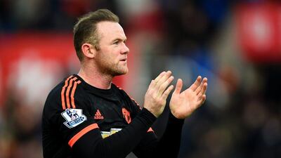Wayne Rooney of Manchester United applauds the fans as he leaves the pitch after the Premier League loss to Stoke City on Saturday. Laurence Griffiths / Getty Images / December 26, 2015
