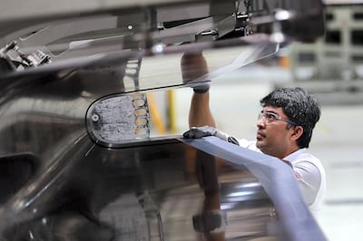 A technician inspects components for Airbus and Boeing planes. Pawan Singh / The National