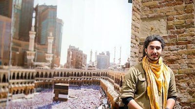 Ahmad Angawi with his lenticular photograph that shows a traditional view of Mecca from one angle and a view of the city choked with new high-rise architecture from another. Photo by Sofia Dadurian