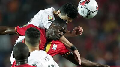 Egypt's Ayman Ashraf, left, in action against Uganda's Faruku Miya. EPA