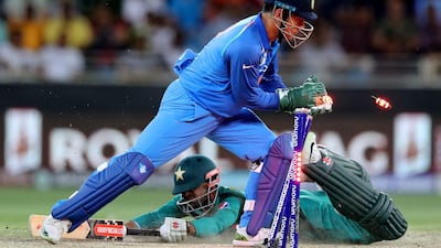 Pakistan's Shadab Khan is safely home despite India's MS Dhoni's efforts.