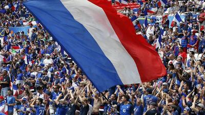 French supporters pack the stadium as a giant France flag is waved ahead of kick-off. Sergey Dolzhenko / EPA