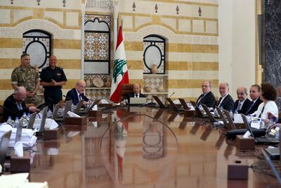 Lebanese President Michel Aoun, centre background, and Lebanese Prime Minister Najib Mikati, left background. AP