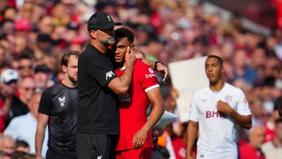 Liverpool's Trent Alexander-Arnold gets a hug from manager Jurgen Klopp after leaving the pitch injured. AP