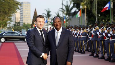 Ivory Coast's President Alassane Ouattara welcomes French President Emmanuel Macron at the Presidential Palace to meet his Ivorian counterpart in Abidjan on December 21, 2019. EPA