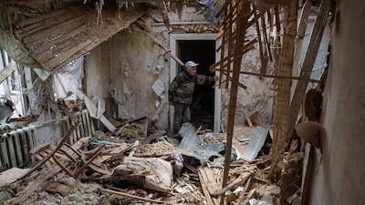 Yurii, 53, stands in his heavily damaged house in Fenevychi. Getty Images