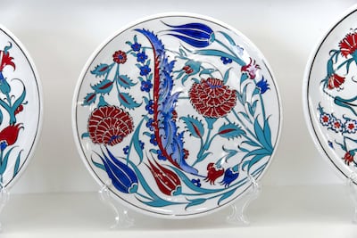 Iznik-inspired ceramic plates are among many items available at Louvre Abu Dhabi's gift shop. Christopher Pike / The National