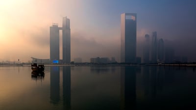 Morning fog along the Corniche in Abu Dhabi. Victor Besa / The National