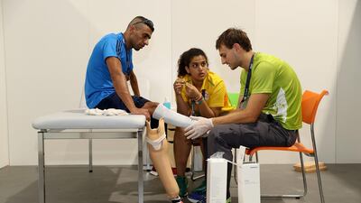 Syrian paralympian Ibrahim Al Hussein, who is competing for the refugee team, receiving an initial consultation with prosthetist Julian Napp with the assistance of translatior Raghda Elessawy at the Ottobock Techincal Repair Service Center in the Paralympic Village on September 4, 2016 in Rio de Janeiro, Brazil. Matthew Stockman/Getty Images