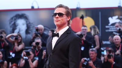 Brad Pitt, wearing a sharp tuxedo paired with adidas trainers, attends the 'Blonde' red carpet at the 79th Venice International Film Festival on September 8. Getty Images
